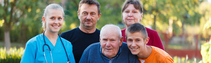 Family visiting grandfather in nursing home