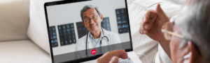 Telehealth visit between elderly man and his physician.
