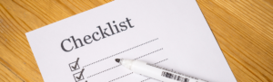 A checklist form with a marker.