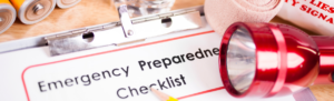 Clipboard and paper stating emergency checklist.