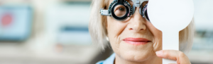 Older woman receiving an eye exam.
