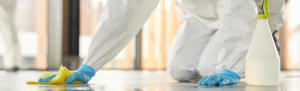 Medical personnel cleaning a floor.