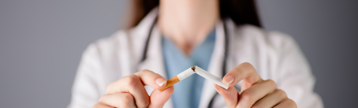 Medical professional holding a broken cigarette.